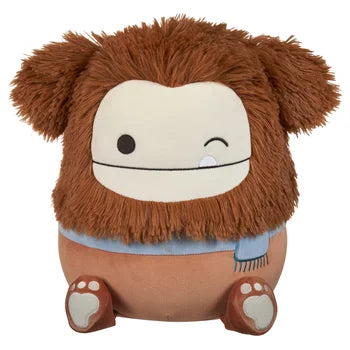 Squishmallow Benny 12-inch (30 cm) brown Bigfoot winking with a pale blue scarf.